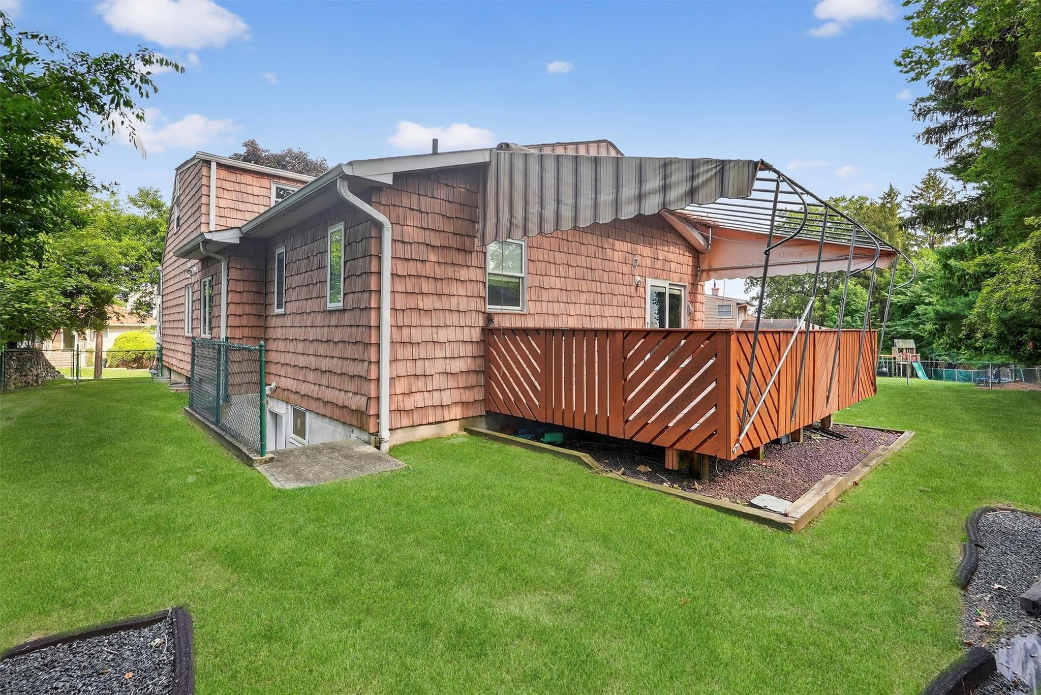 15 Dr Frank Road Spring Valley, NY 10977 - Photo 40 of 50 Back of property featuring a playground