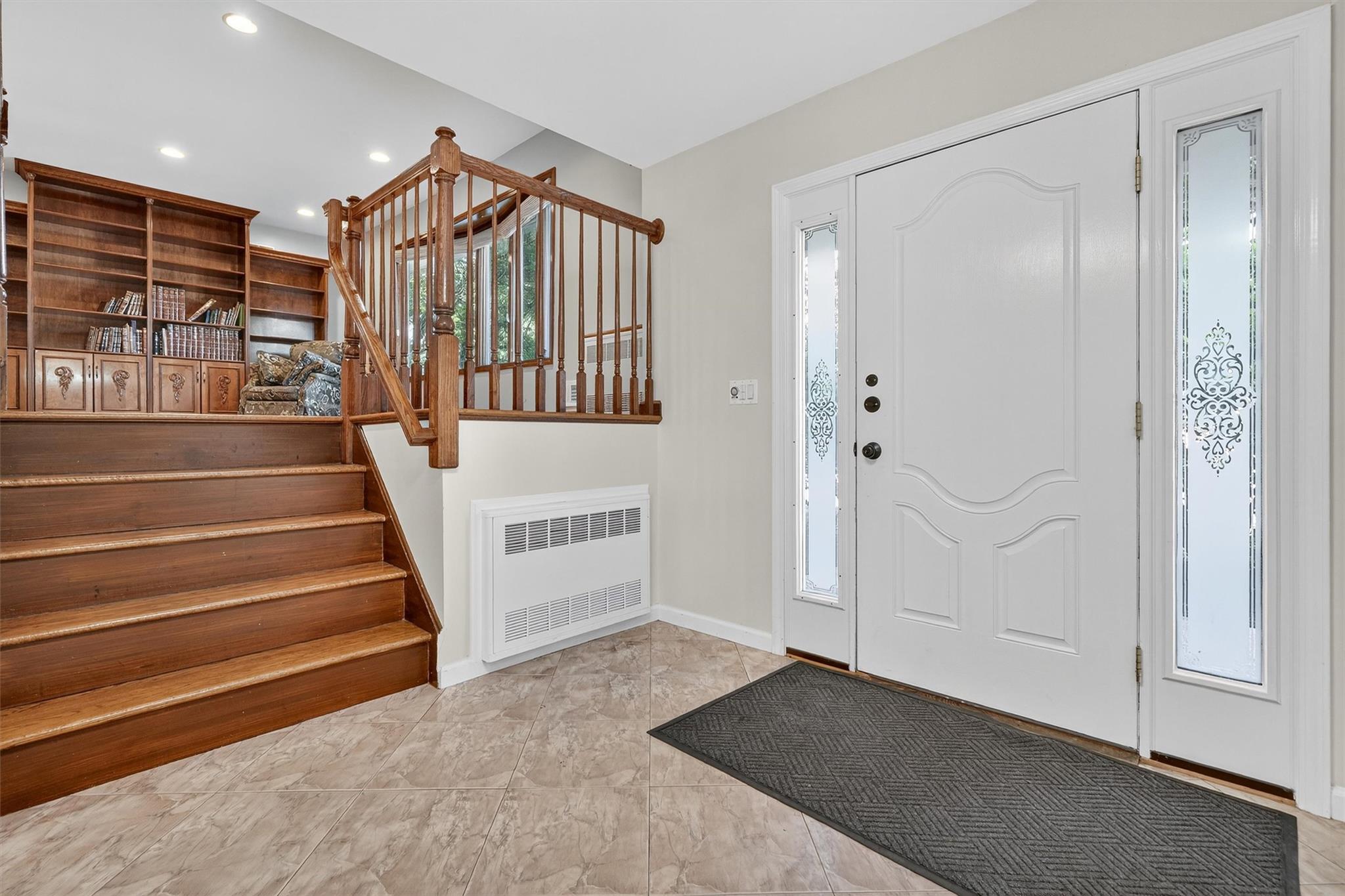 15 Dr Frank Road Spring Valley, NY 10977 - Photo 5 of 50 Entrance foyer with radiator heating unit, stairs, and recessed lighting