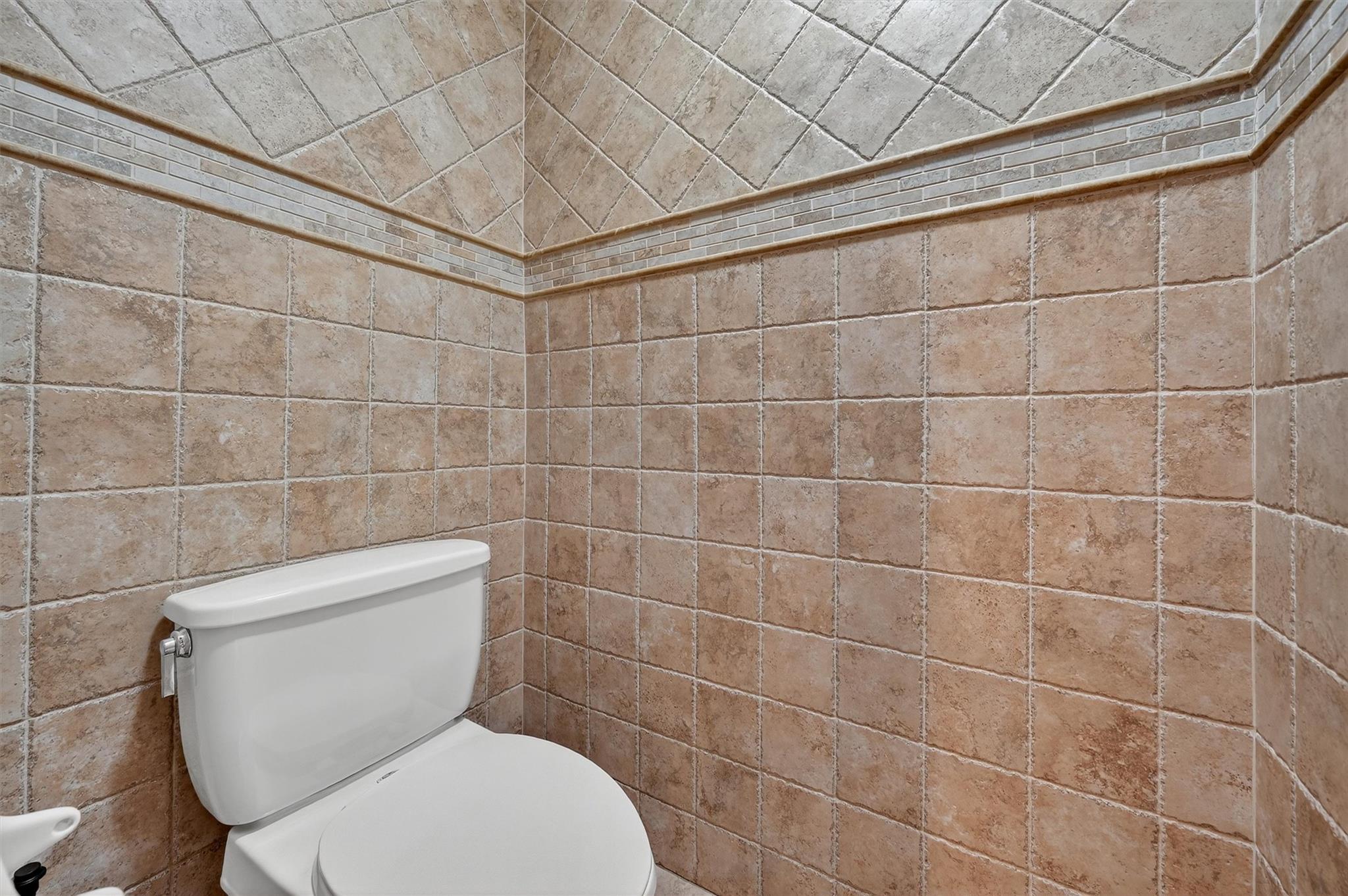 15 Dr Frank Road Spring Valley, NY 10977 - Photo 10 of 50 Bathroom with toilet and tile walls