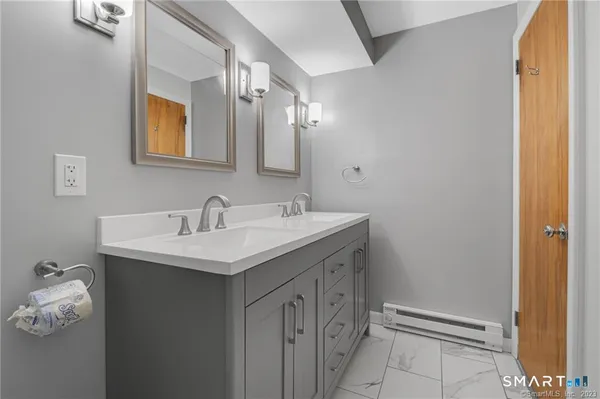 a bathroom with a sink and a mirror