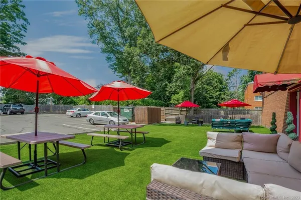 a view of a backyard with sitting area