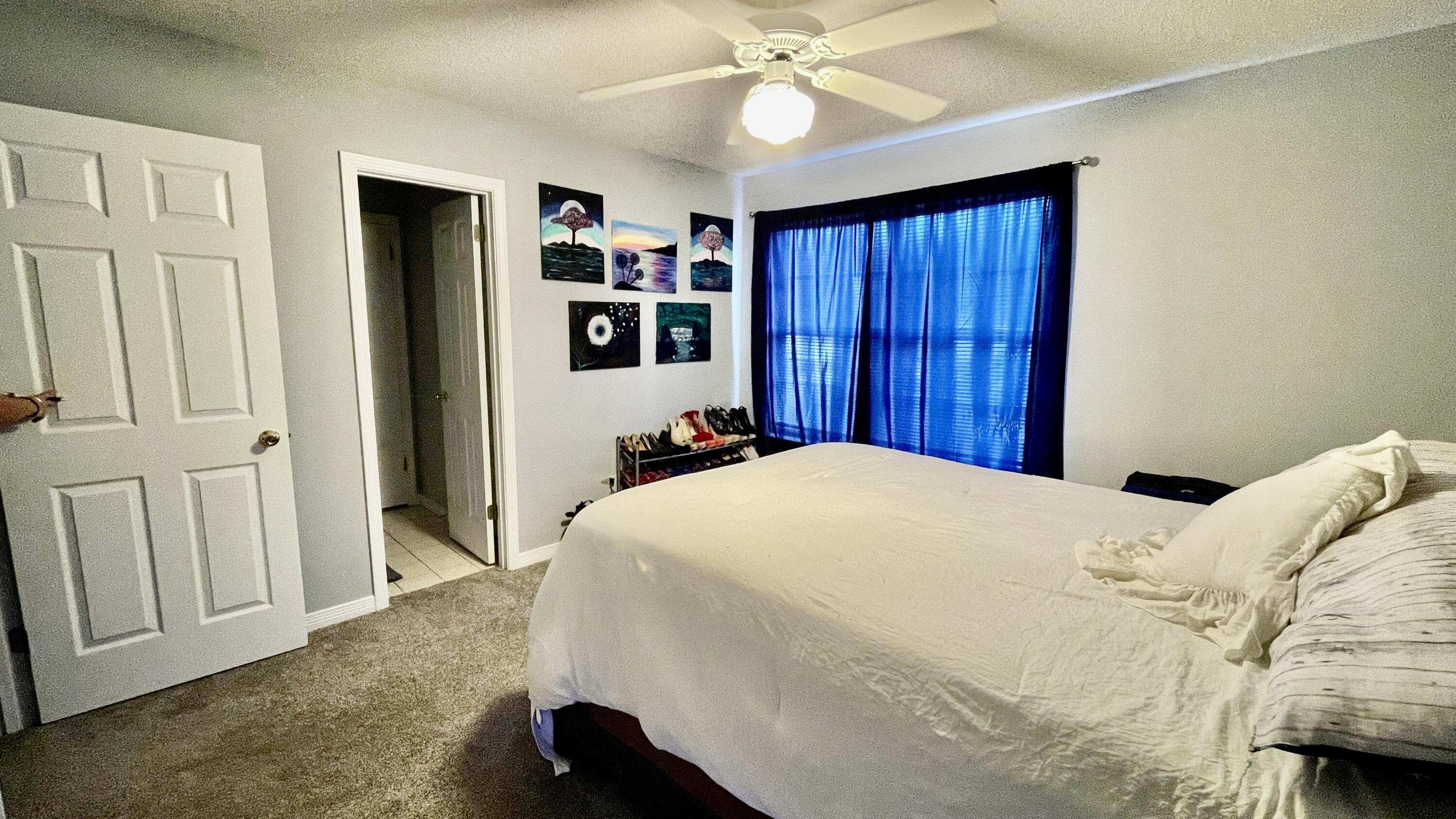 4467 Kingslynn Road Niceville, FL 32578 - Photo 11 of 28 a bed room with a bed and a view of bedroom