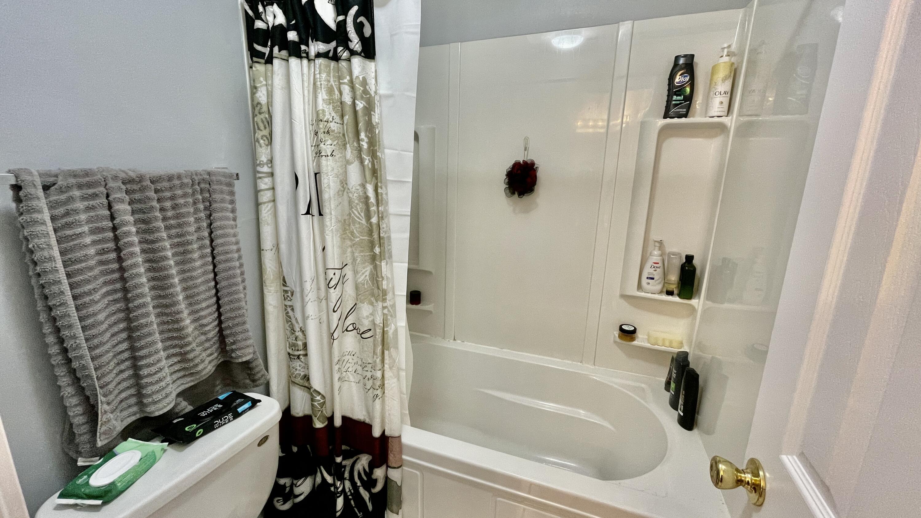4467 Kingslynn Road Niceville, FL 32578 - Photo 13 of 28 a bathroom with a shower