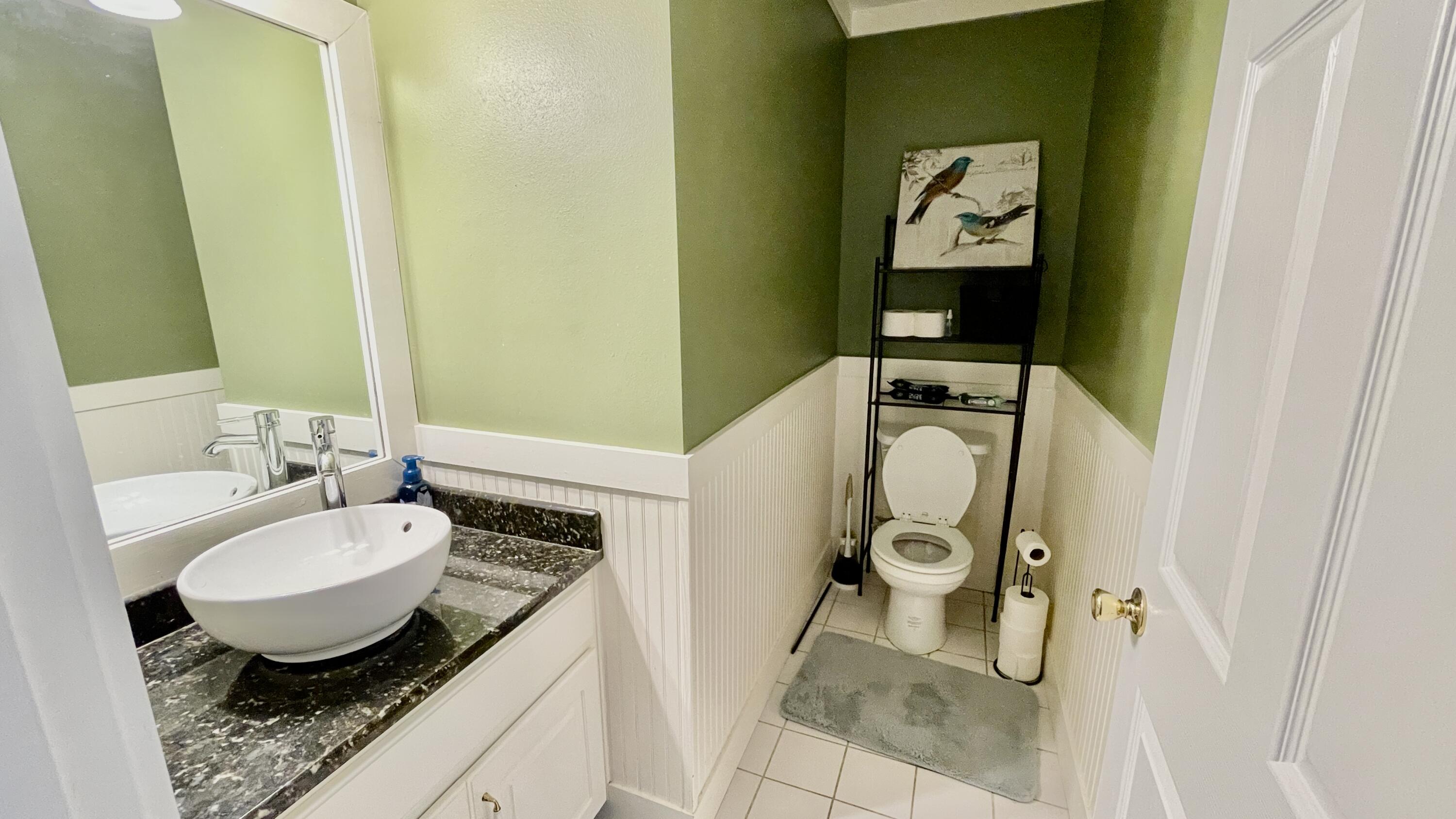 4467 Kingslynn Road Niceville, FL 32578 - Photo 14 of 28 a bathroom with a granite countertop sink and a mirror