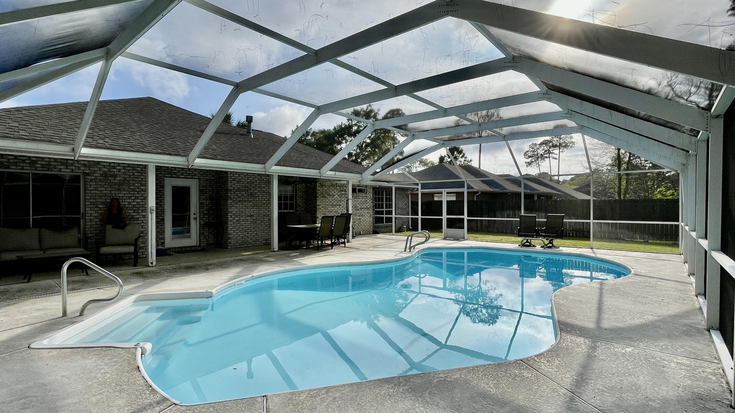 4467 Kingslynn Road Niceville, FL 32578 - Photo 20 of 28 a view of swimming pool with seating area