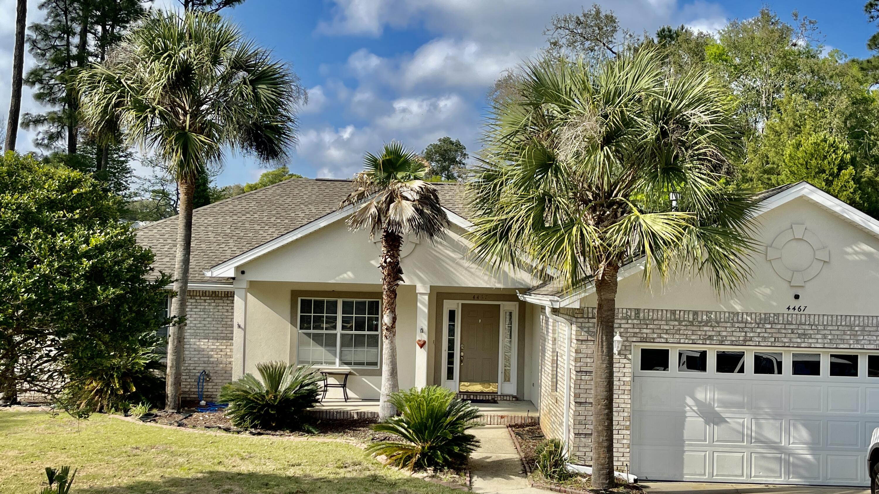 4467 Kingslynn Road Niceville, FL 32578 - Photo 2 of 28 front view of a house with a garden