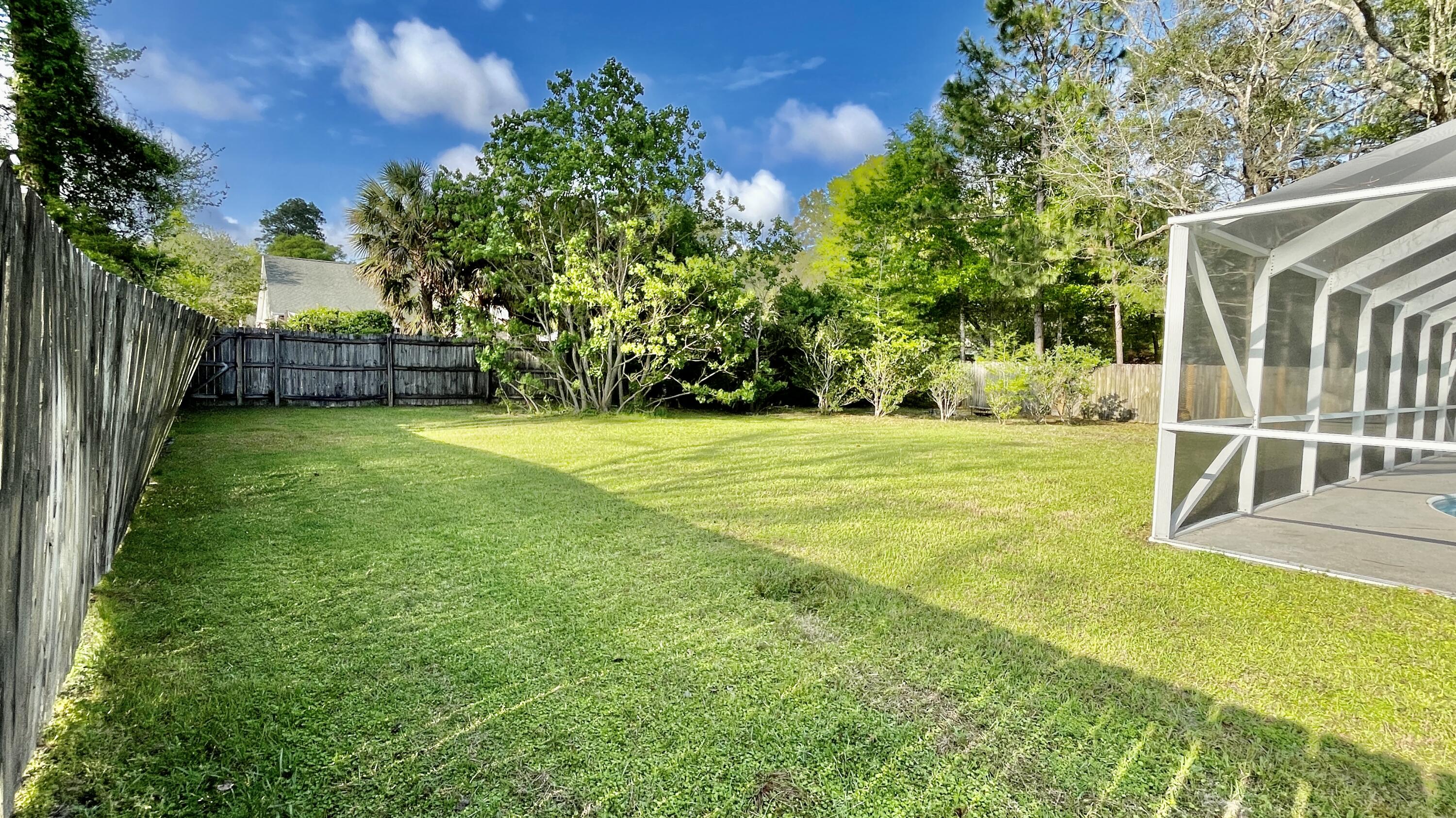 4467 Kingslynn Road Niceville, FL 32578 - Photo 24 of 28 a view of a patio with a yard