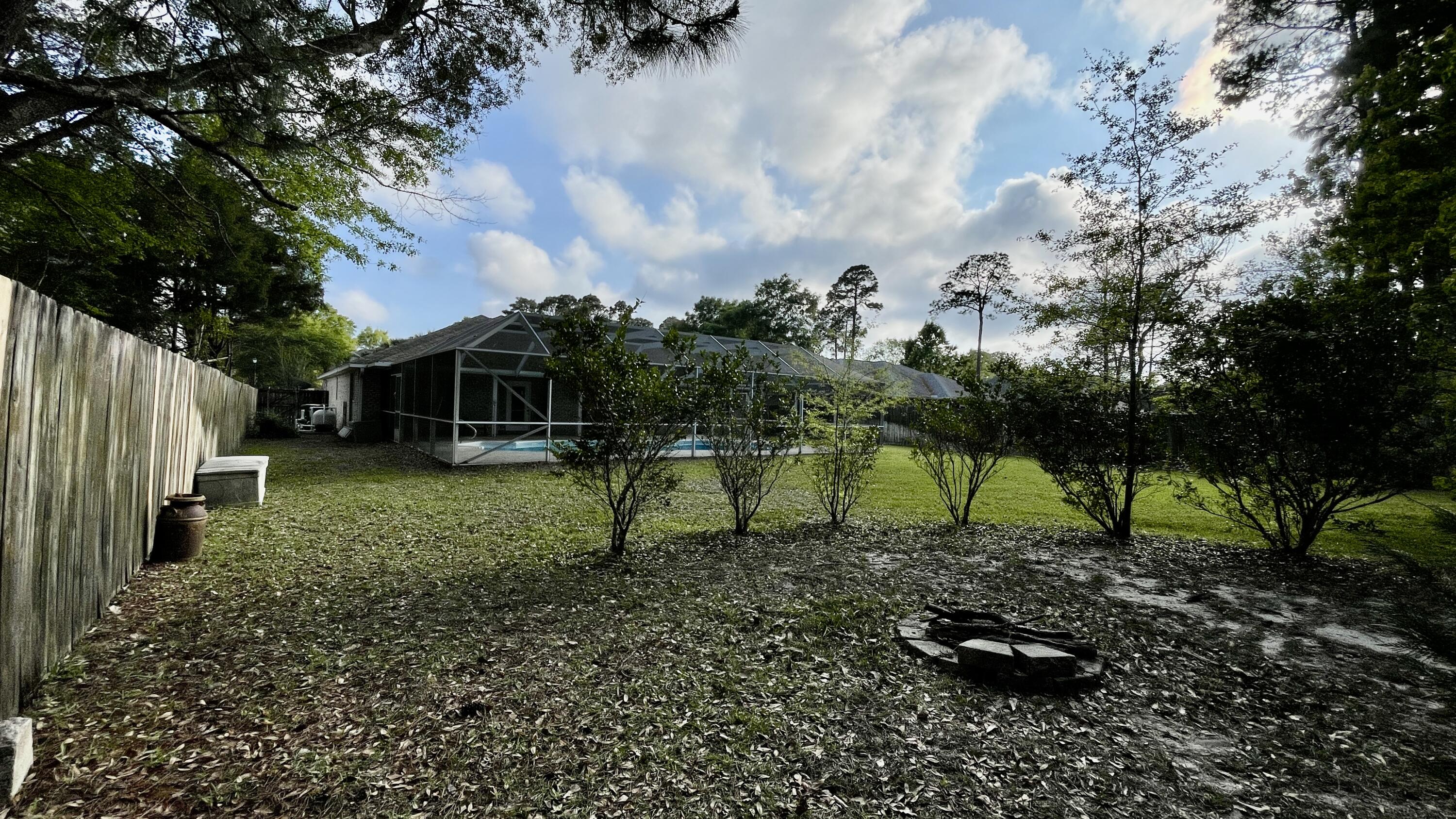 4467 Kingslynn Road Niceville, FL 32578 - Photo 27 of 28 a green field covered with trees