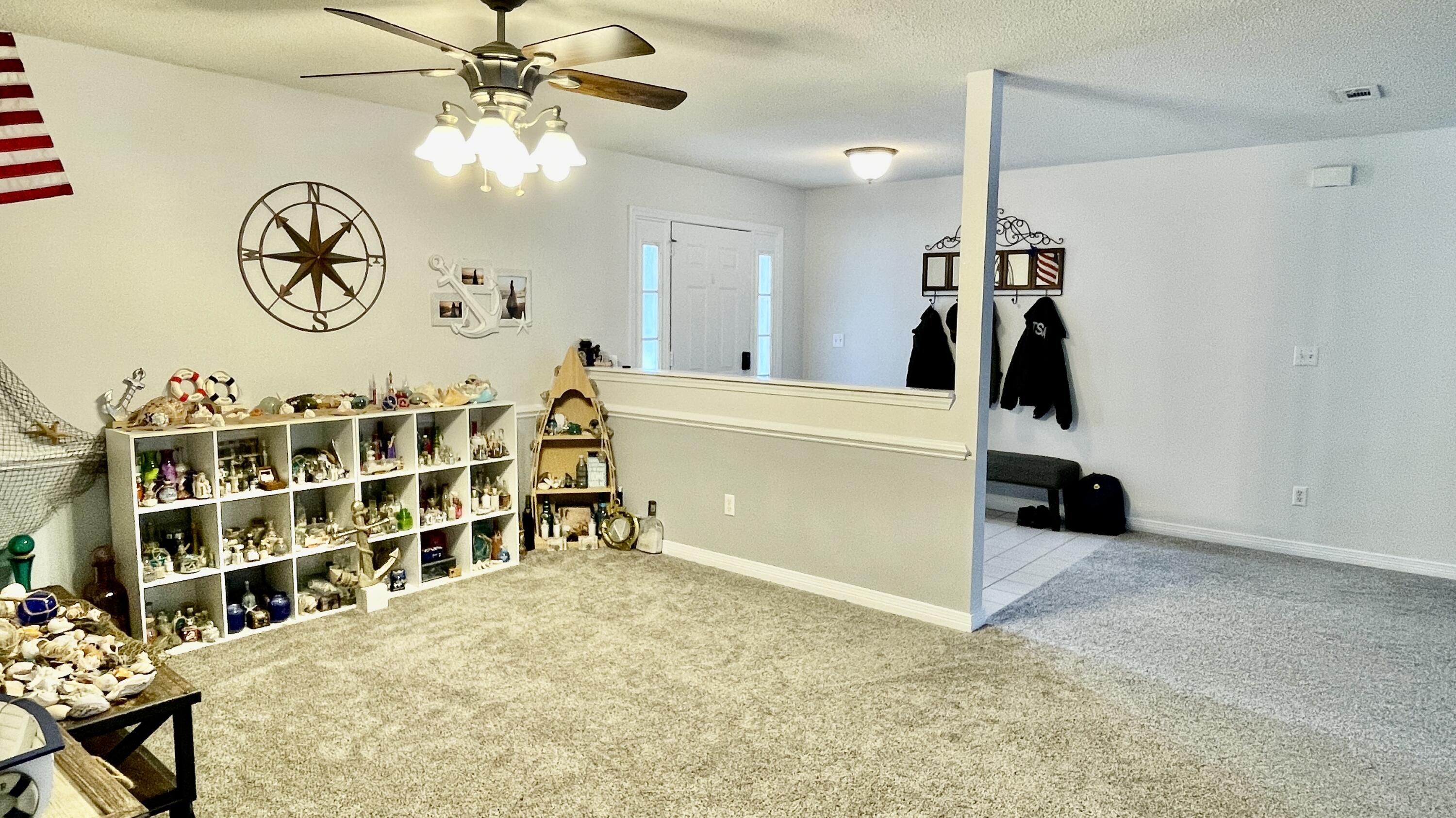 4467 Kingslynn Road Niceville, FL 32578 - Photo 6 of 28 a view of a livingroom with furniture and a rug