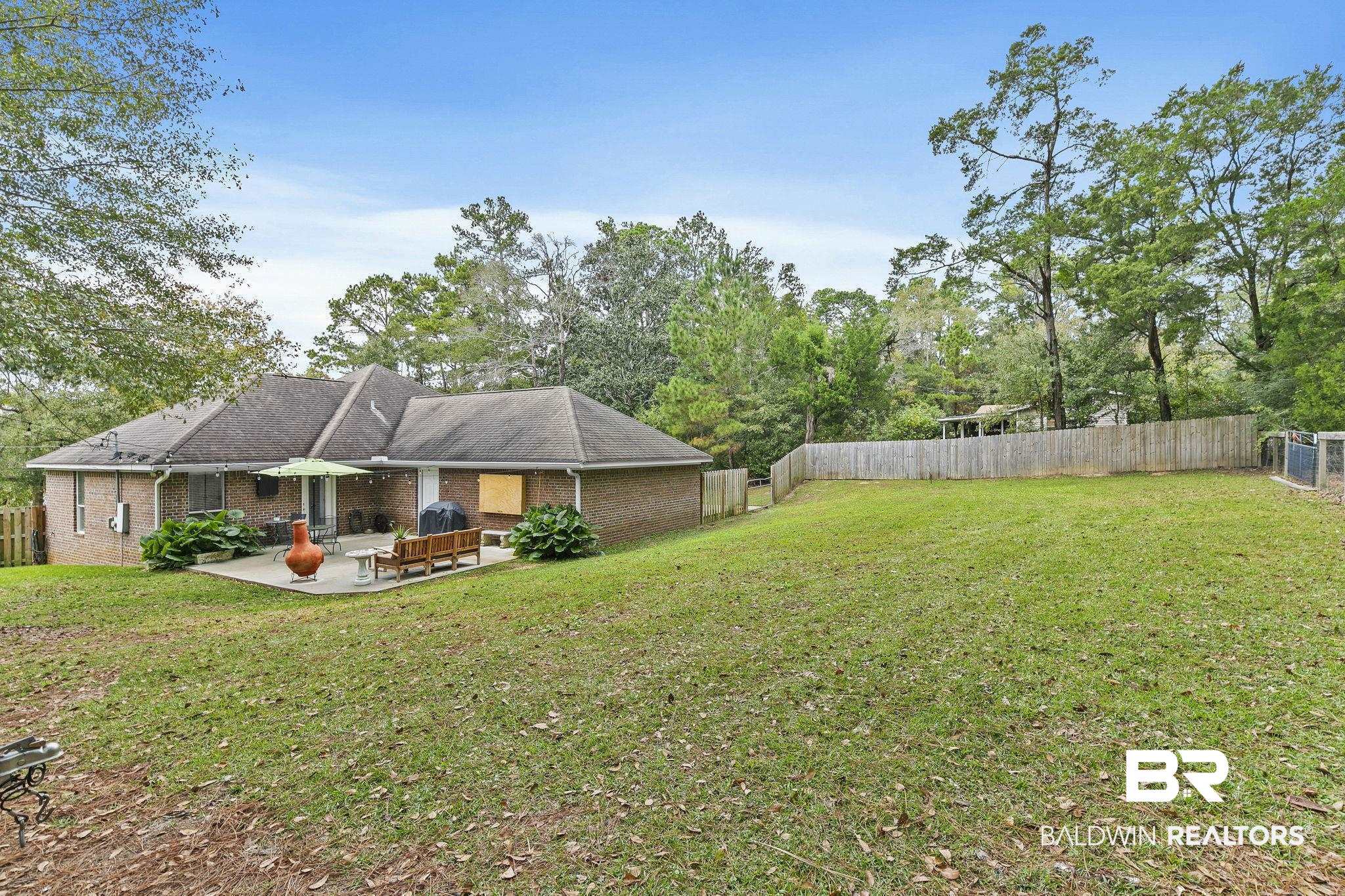 32072 Buzbee Road Daphne, AL 36527 - Photo 29 of 41 View of yard with a patio