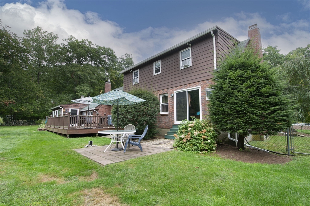 926 Old Turnpike Road Oakham, MA 01068 - Photo 11 of 42 a house view with a garden space and garden