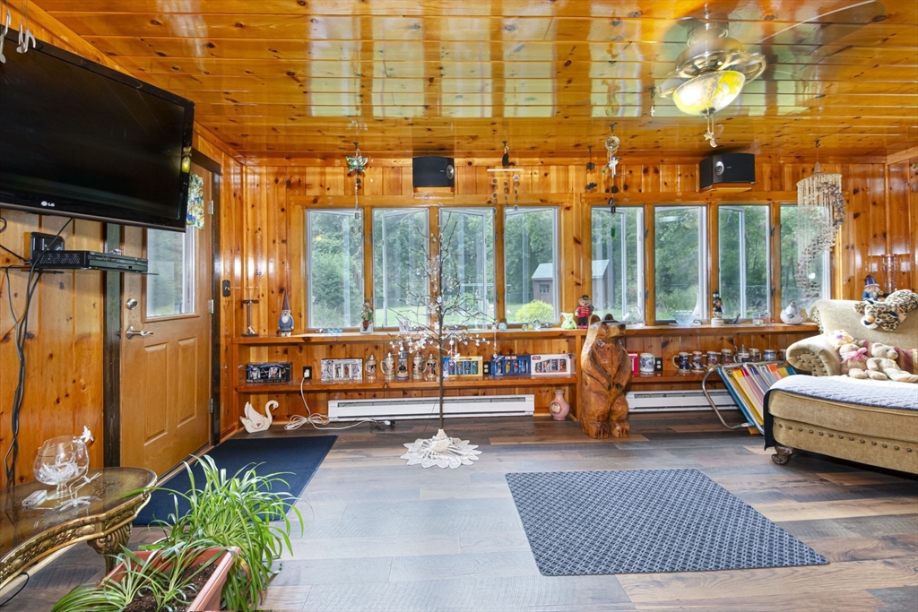 926 Old Turnpike Road Oakham, MA 01068 - Photo 15 of 42 a outdoor space with patio furniture and a flat screen tv