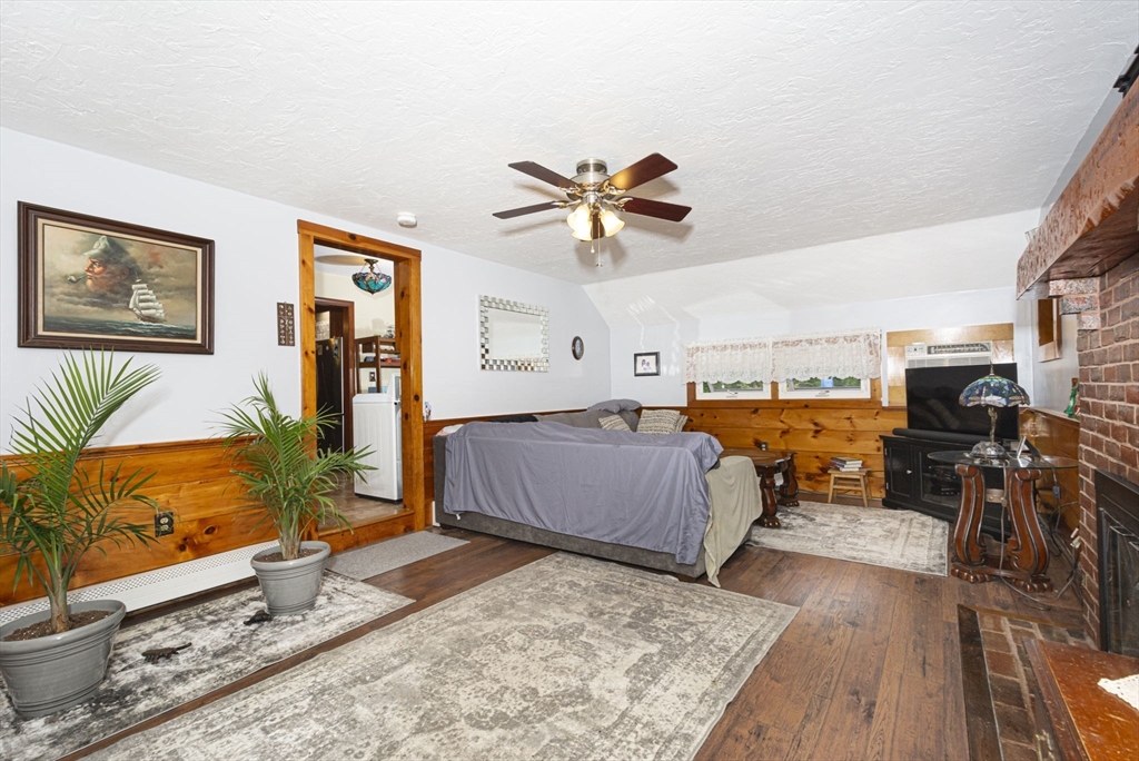 926 Old Turnpike Road Oakham, MA 01068 - Photo 17 of 42 a bedroom with furniture and a large window