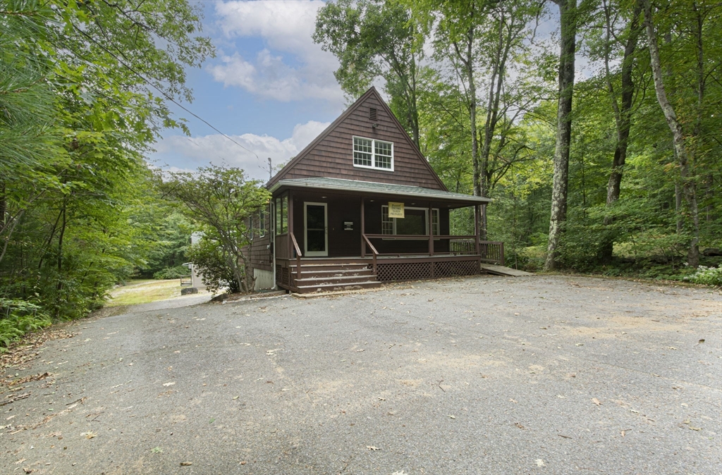926 Old Turnpike Road Oakham, MA 01068 - Photo 33 of 42 a front view of a house with a tree in it