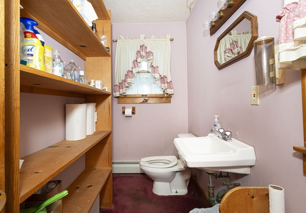 926 Old Turnpike Road Oakham, MA 01068 - Photo 38 of 42 a bathroom with a sink mirror and toilet