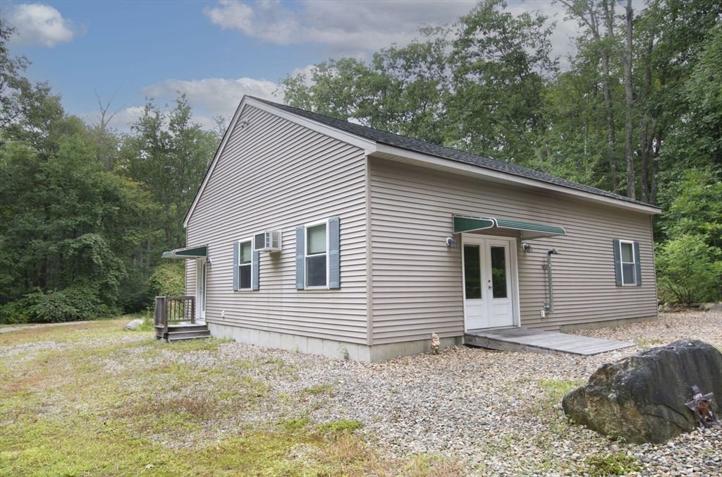 926 Old Turnpike Road Oakham, MA 01068 - Photo 4 of 42 a backyard of a house