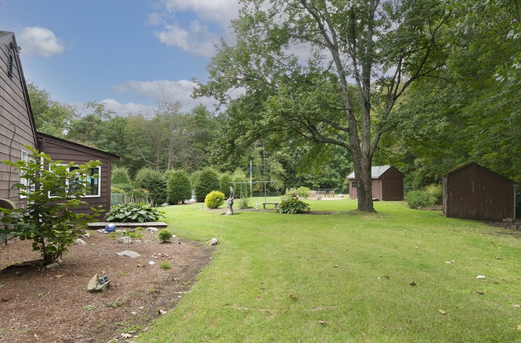 926 Old Turnpike Road Oakham, MA 01068 - Photo 7 of 42 a view of a tree in front of a house