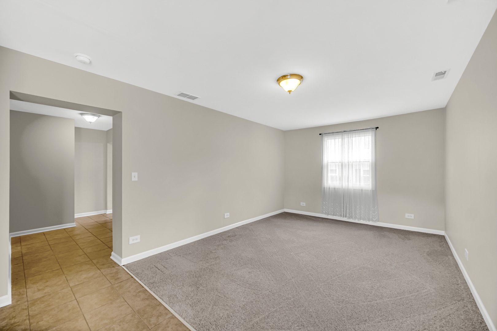 1455 Reckinger Road Aurora, IL 60505 - Photo 12 of 26 a view of an empty room with a window