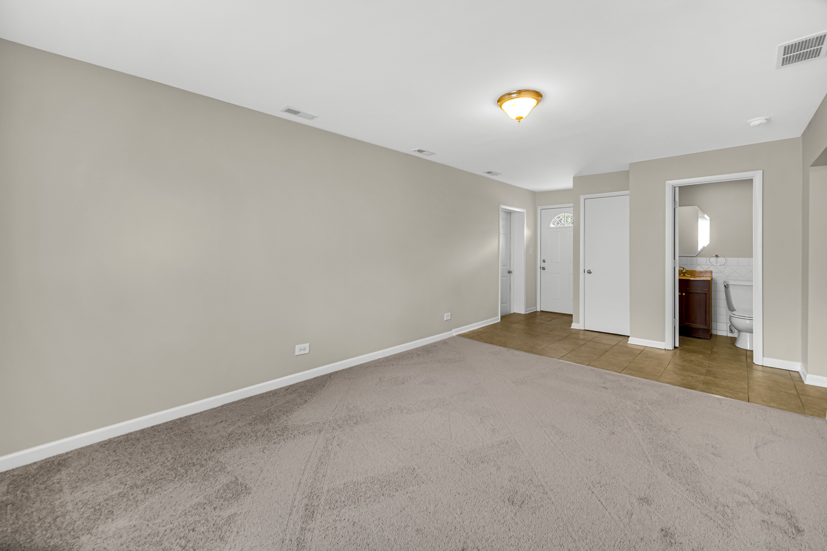 1455 Reckinger Road Aurora, IL 60505 - Photo 13 of 26 a view of a livingroom with wooden floor and a ceiling fan