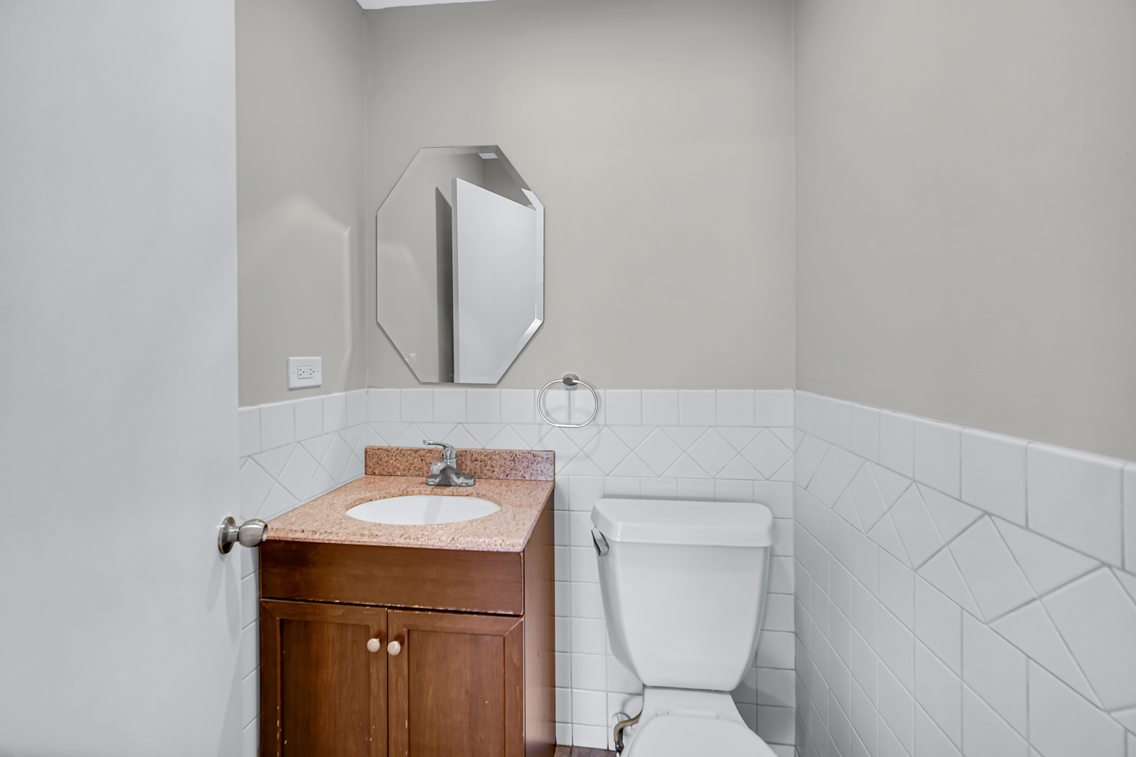 1455 Reckinger Road Aurora, IL 60505 - Photo 21 of 26 a bathroom with a toilet sink and mirror