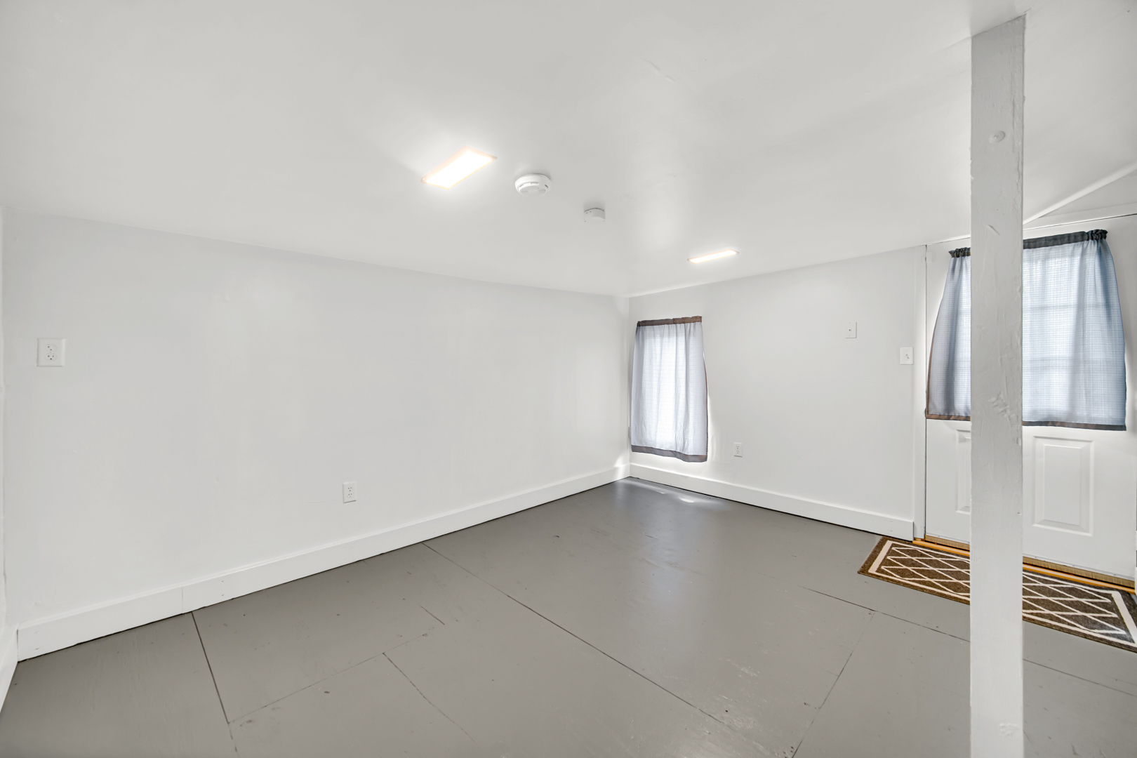 1455 Reckinger Road Aurora, IL 60505 - Photo 22 of 26 an empty room with windows