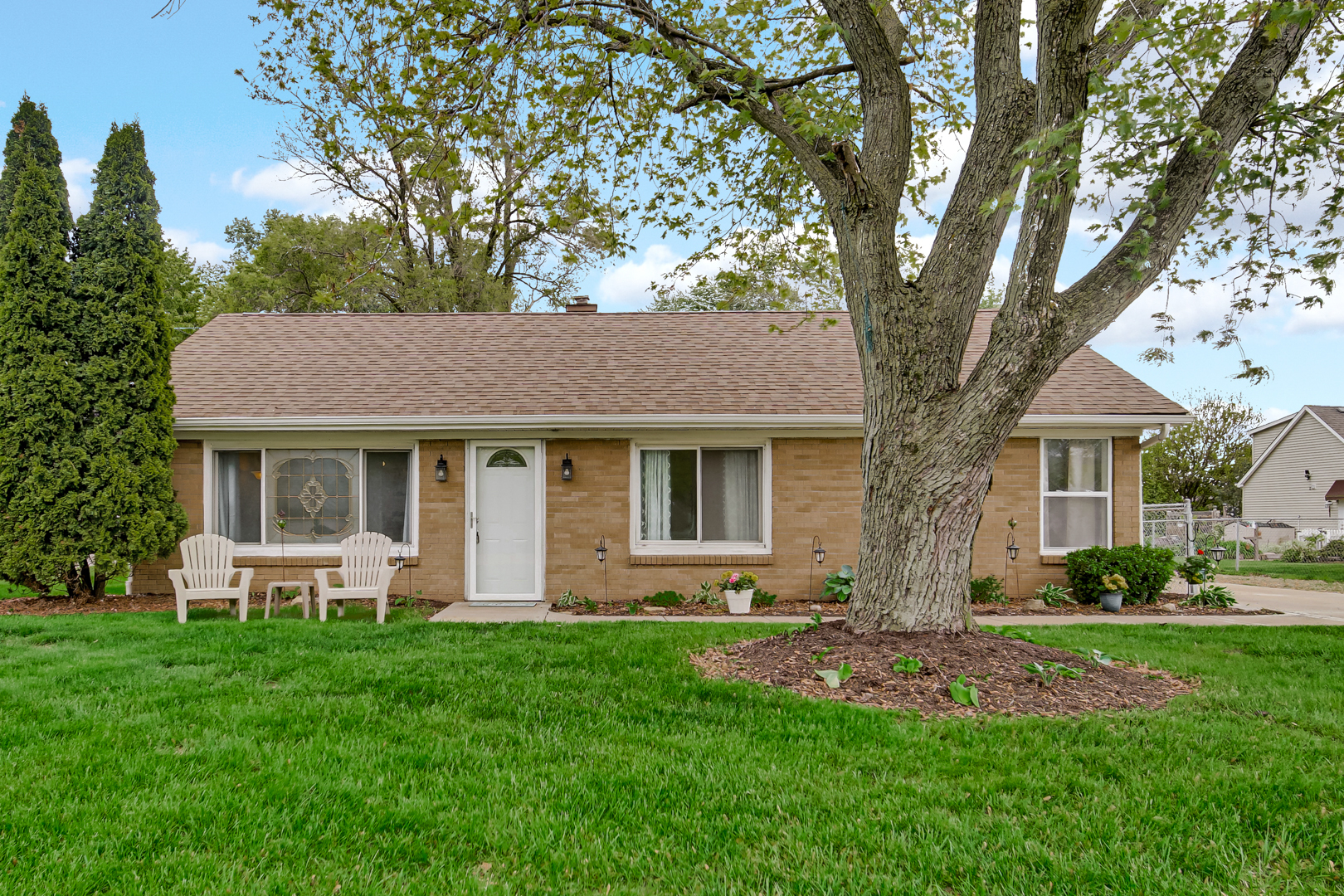 1455 Reckinger Road Aurora, IL 60505 - Photo 26 of 26 a front view of a house with a yard and trees