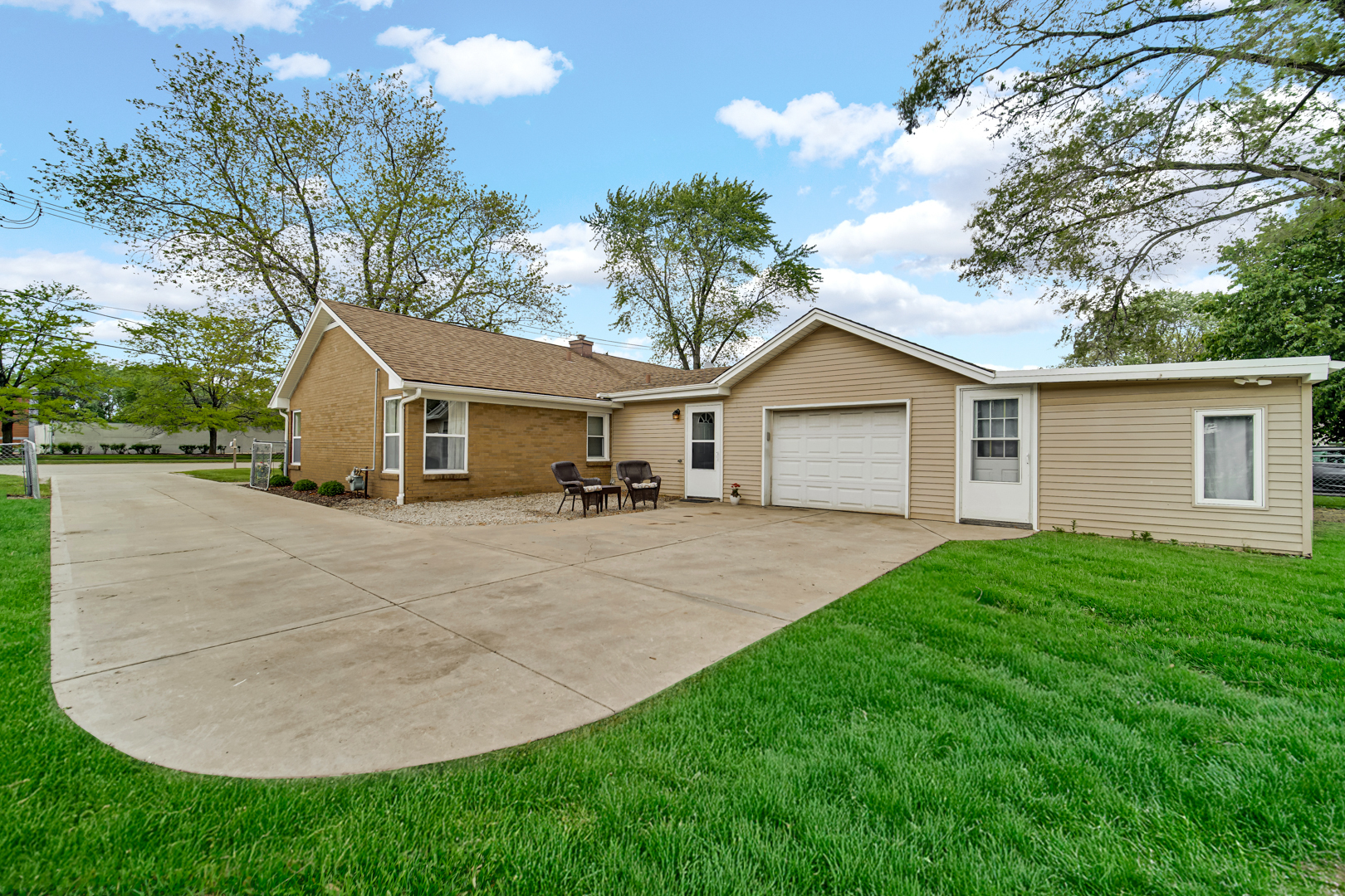 1455 Reckinger Road Aurora, IL 60505 - Photo 3 of 26 a view of a yard in front of a house with large trees