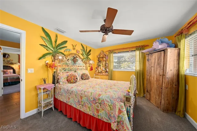 a bathroom with a sink mirror vanity and toilet