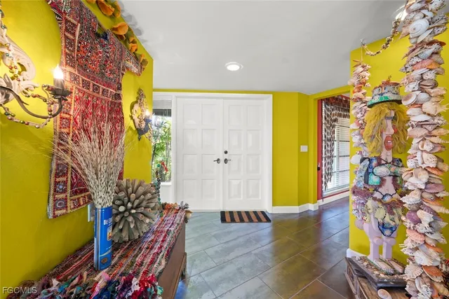 a bedroom with furniture and wooden floor