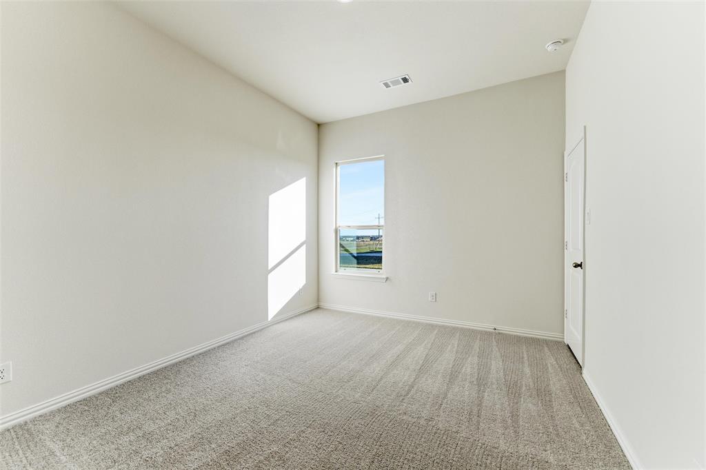 1030 County Road 200 Valley View, TX 76272 - Photo 18 of 27 Unfurnished room featuring light colored carpet and baseboards