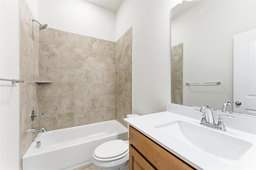 1030 County Road 200 Valley View, TX 76272 - Photo 20 of 27 Bathroom featuring shower / bath combination and vanity