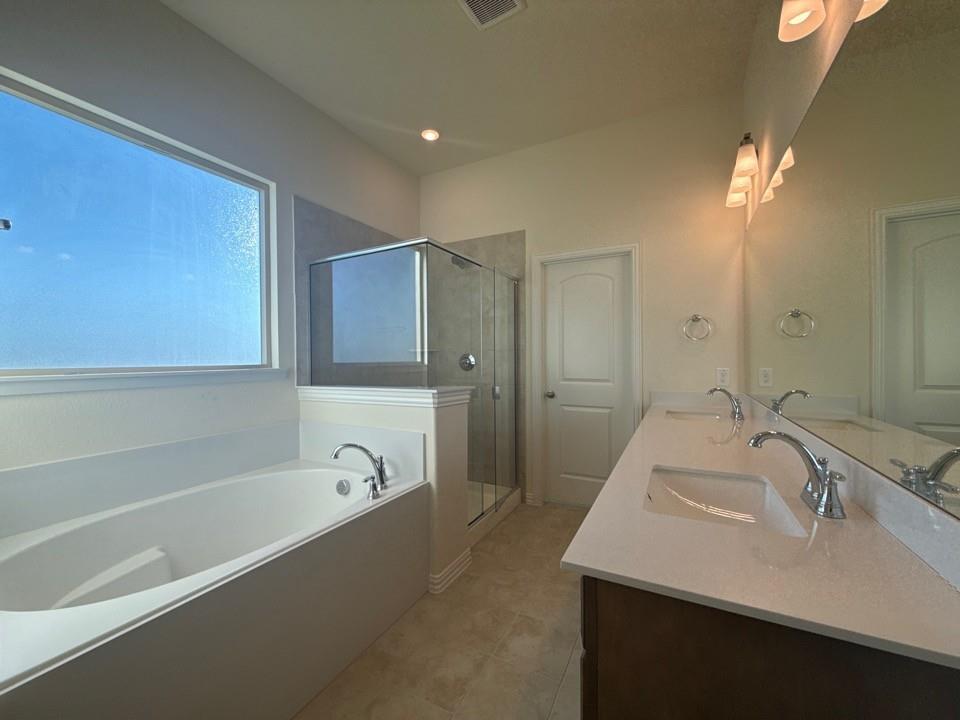 1030 County Road 200 Valley View, TX 76272 - Photo 6 of 8 a bathroom with a tub sink and mirror