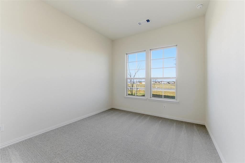 1030 County Road 200 Valley View, TX 76272 - Photo 9 of 27 Unfurnished room with light carpet and baseboards