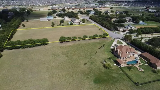 an aerial view of a house with a lake view