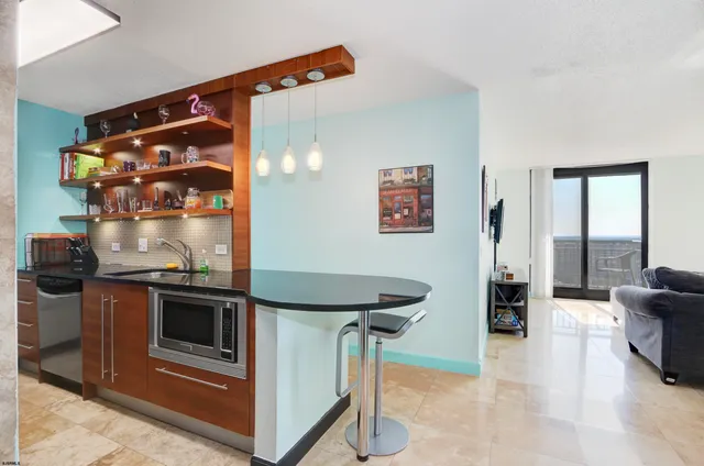 a kitchen with stainless steel appliances granite countertop a stove and a refrigerator