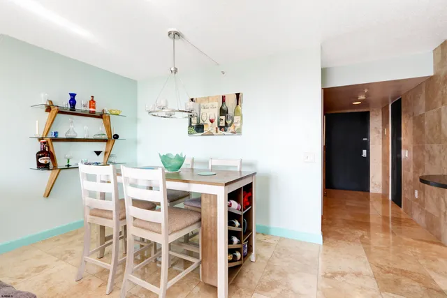 a view of kitchen with furniture and wooden floor