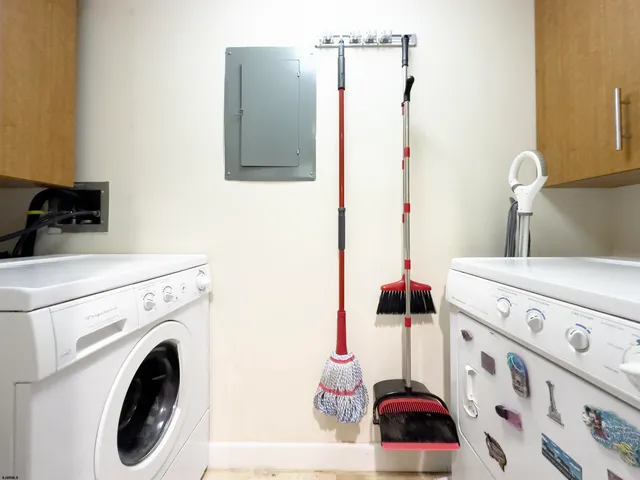 a bathroom with a sink and a washing machine