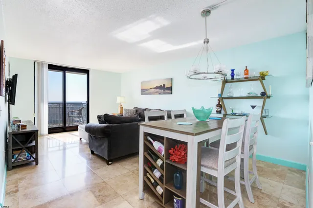 a view of a kitchen and dining room