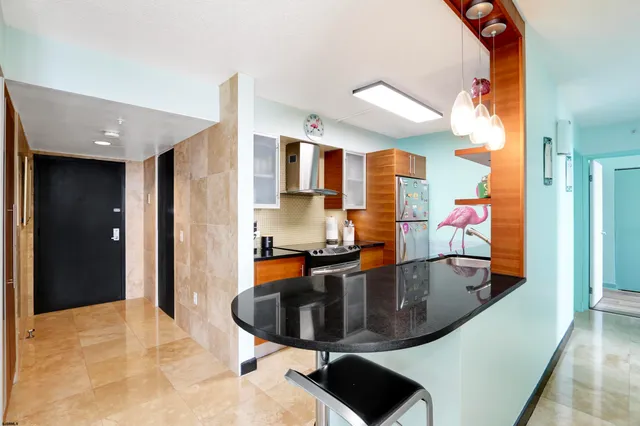a kitchen with a sink and natural light