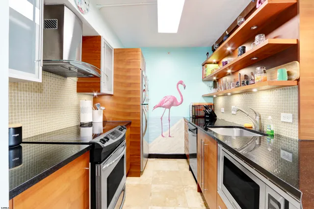 a kitchen with a sink stove and refrigerator