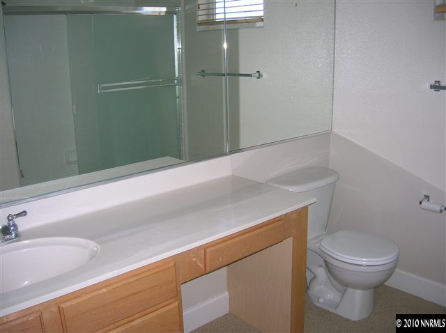 513 Spirit Ridge Court Reno, NV 89511 - Photo 12 of 13 a bathroom with a sink a toilet and shower