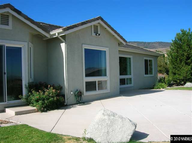 513 Spirit Ridge Court Reno, NV 89511 - Photo 3 of 13 a front view of a house with a yard