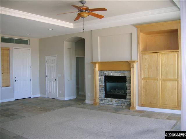 513 Spirit Ridge Court Reno, NV 89511 - Photo 8 of 13 a view of a livingroom with a fireplace and window