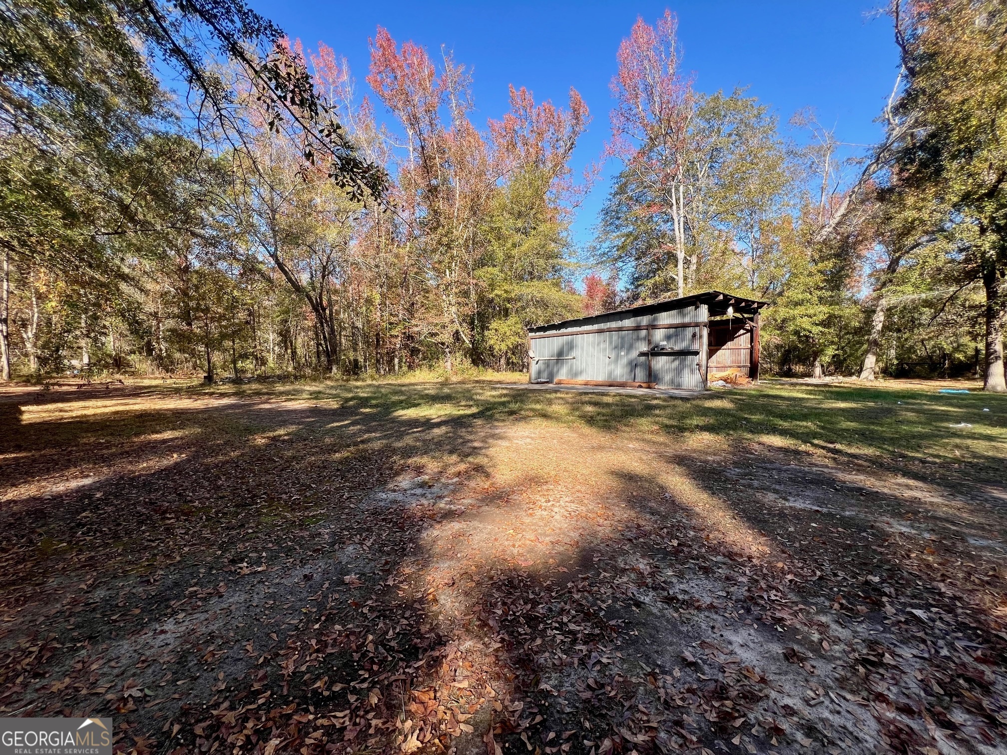 3195 Henderson Grove Road Sandersville, GA 31082 - Photo 37 of 50 a view of a yard with swimming pool