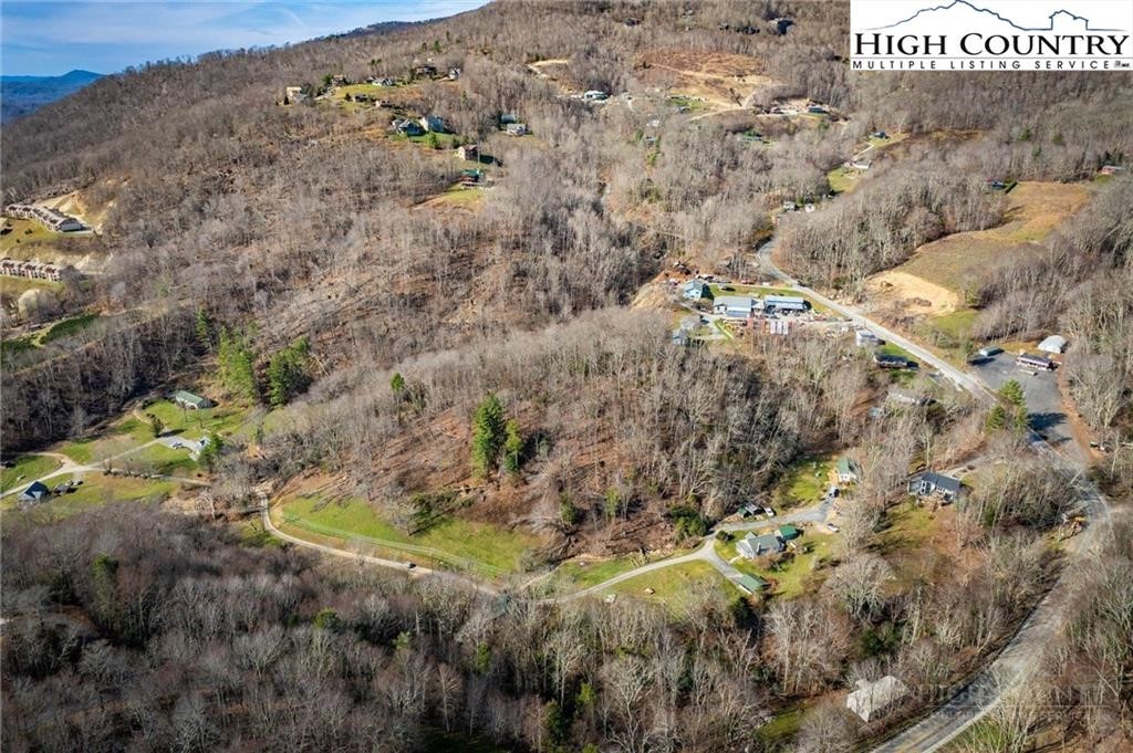 344-348 Tumbling Brook Road Banner Elk, NC 28604 - Photo 21 of 35 a aerial view of a house with a yard