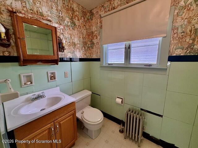 706 Delaware Street Forest City, PA 18421 - Photo 22 of 33 a bathroom with a toilet sink and mirror