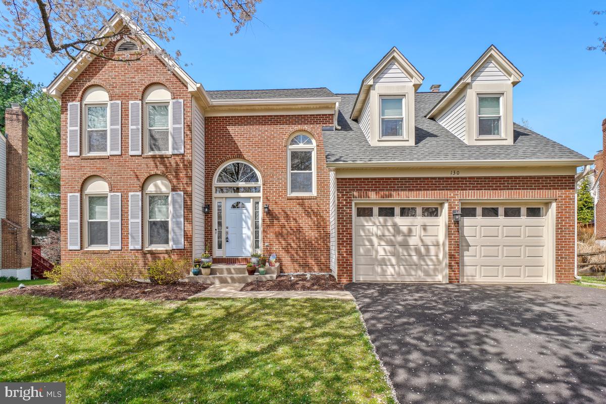 130 Englefield Drive Gaithersburg, MD 20878 - Photo 1 of 33 a front view of a house with a yard