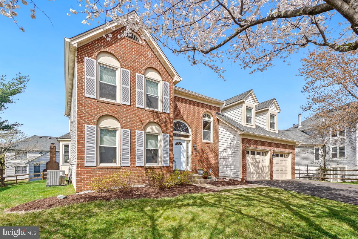 130 Englefield Drive Gaithersburg, MD 20878 - Photo 2 of 33 a front view of a house with a yard