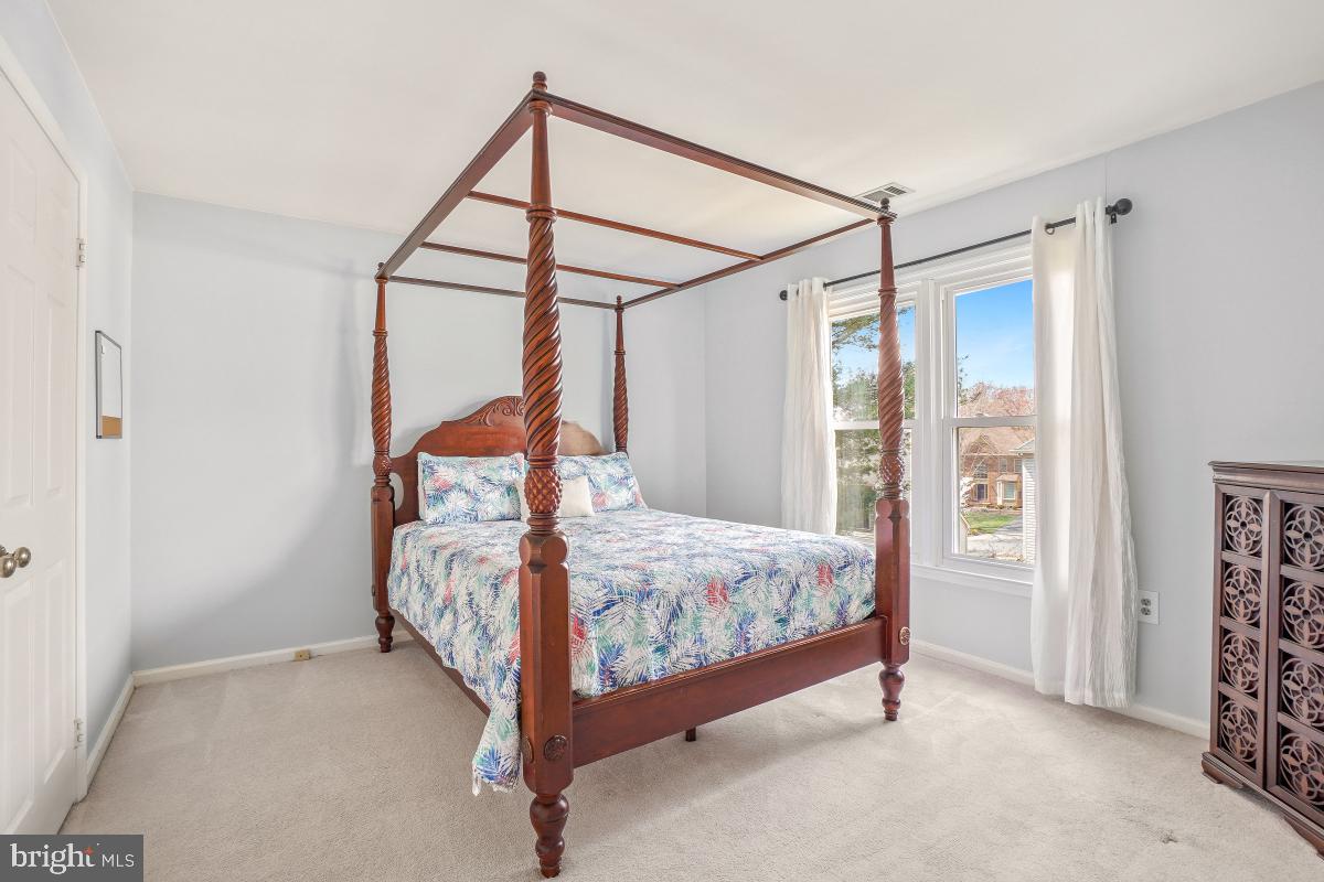 130 Englefield Drive Gaithersburg, MD 20878 - Photo 21 of 33 a bed sitting in a bedroom next to a window