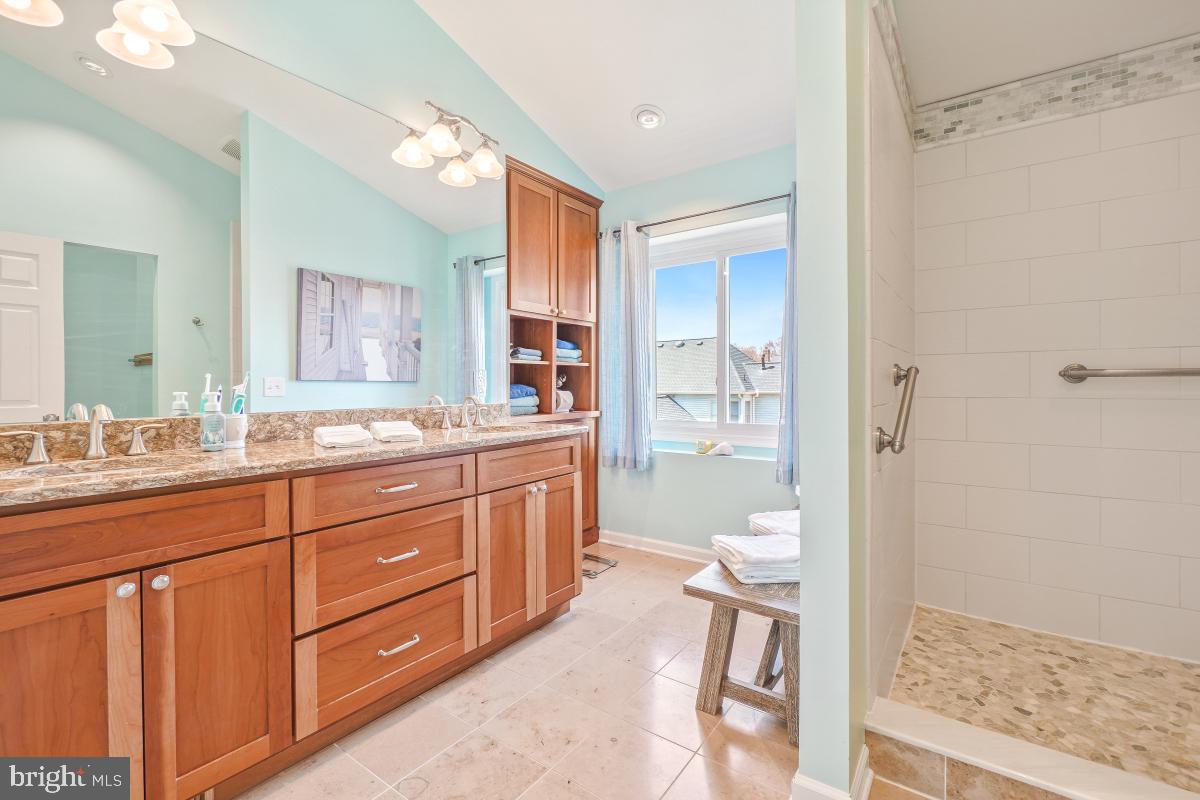 130 Englefield Drive Gaithersburg, MD 20878 - Photo 25 of 33 a spacious bathroom with a granite countertop sink mirror and a shower